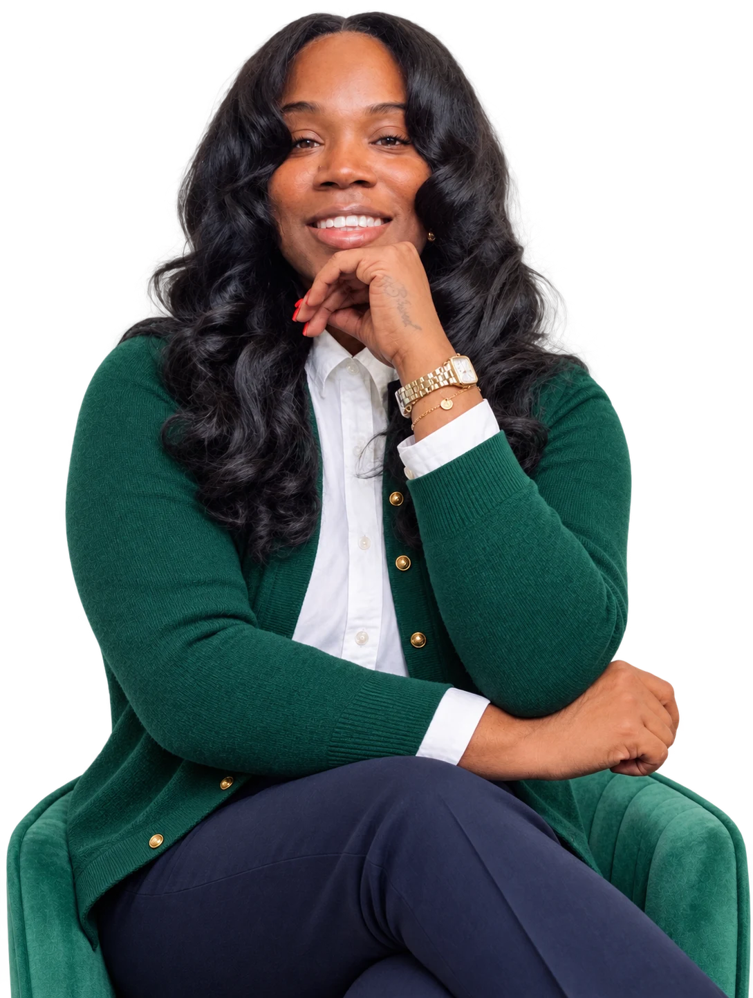 Rasheeda S. Williams seated in a green cardigan and navy trousers
